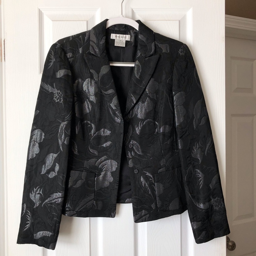 Black blazer with silver thread accents.